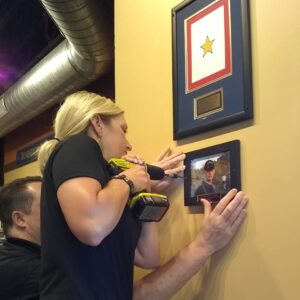 Attaching Chris Patterson's picture to the new Gold Star wall.  Mission BBQ in Downer's Grove, IL.